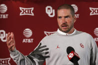 In this Aug. 2, 2019, photo, Oklahoma defensive coordinator Alex Grinch answers a question during the NCAA college football team's media day in Norman, Okla. Grinch, the man who previously rebuilt Washington State's defense and more recently was co-defensive coordinator at Ohio State, is bringing his aggressive approach to Oklahoma. (AP Photo/Sue Ogrocki)