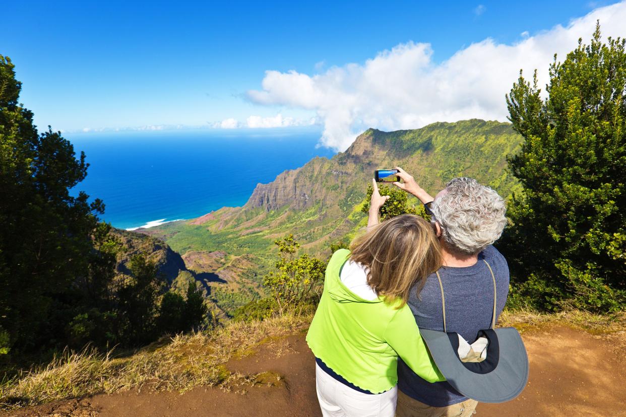 senior tourist couple at Waimea Canyon State Park Kalalau Beach, Kauai, Hawaii