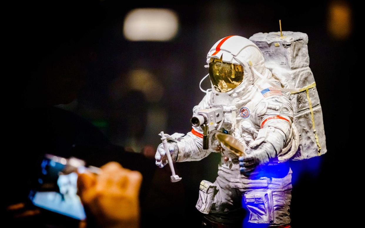A model of an astronaut carrying a camera is displayed during the exhibition '50 Years of Moon landing' at the Space Expo in Noordwijk, The Netherlands - now the European Space Agency is launch a moon landing project - REX