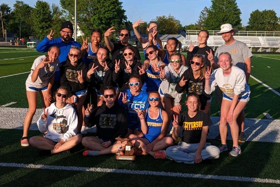 Jefferson's girls track and field team celebrates after taking third place in the Michigan Interscholastic Track Coaches Team State Meet Friday.