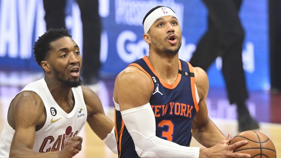 Apr 26, 2023; Cleveland, Ohio, USA; New York Knicks guard Josh Hart (3) drives beside Cleveland Cavaliers guard Donovan Mitchell (45) in the first quarter during game five of the 2023 NBA playoffs at Rocket Mortgage FieldHouse.