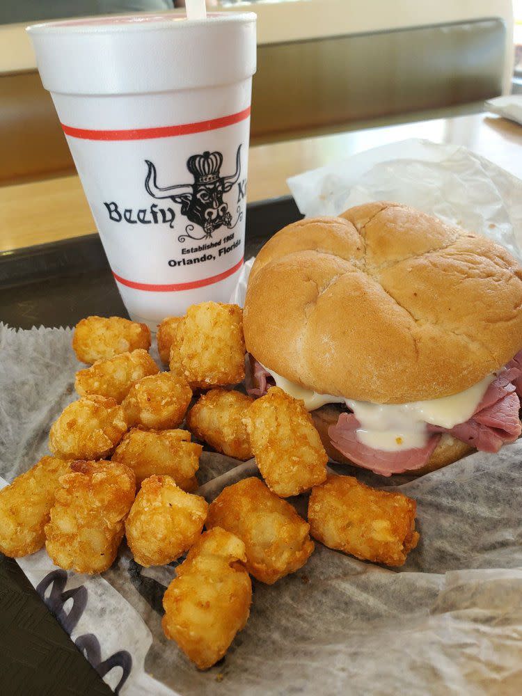 Roast Beef Sandwich with tater tots and styrofoam cup at Beefy King in Orlando, Florida