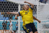 Sweden's Emil Forsberg celebrates after scoring his side's opening goal during the Euro 2020 soccer championship group E match between Sweden and Slovakia, at the Saint Petersburg stadium, in Saint Petersburg, Russia, Friday, June 18, 2021. (Anatoly Maltsev, Pool via AP)