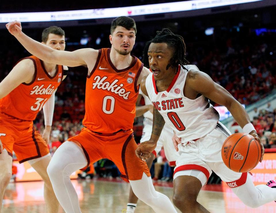 N.C. State’s DJ Horne drives past Virginia Tech’s Hunter Cattoor during the first half of the Wolfpack’s game on Saturday, Jan. 20, 2024, at PNC Arena in Raleigh, N.C.