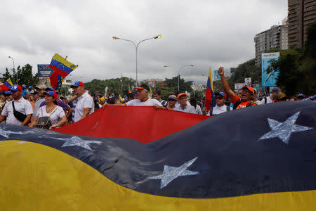 Opposition supporters take part in a rally against Venezuelan President Nicolas Maduro's government and to commemorate the 61st anniversary of the end of the dictatorship of Marcos Perez Jimenez in Caracas, Venezuela January 23, 2019. REUTERS/Adriana Loureiro NO RESALES. NO ARCHIVES.