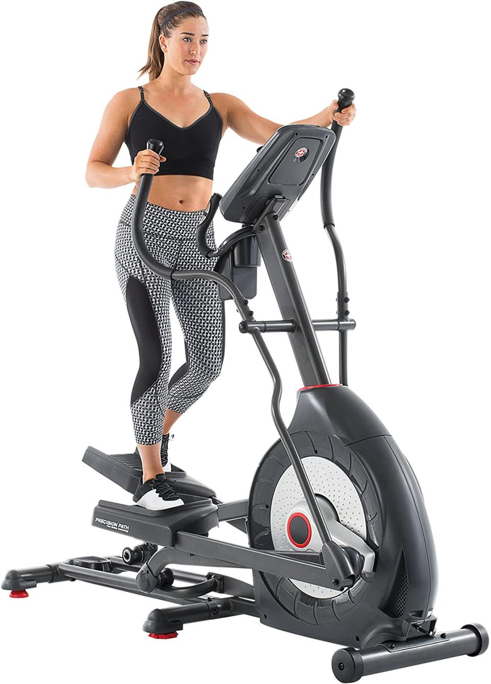 Woman uses Schwinn Fitness 430 Elliptical; best home gym machines