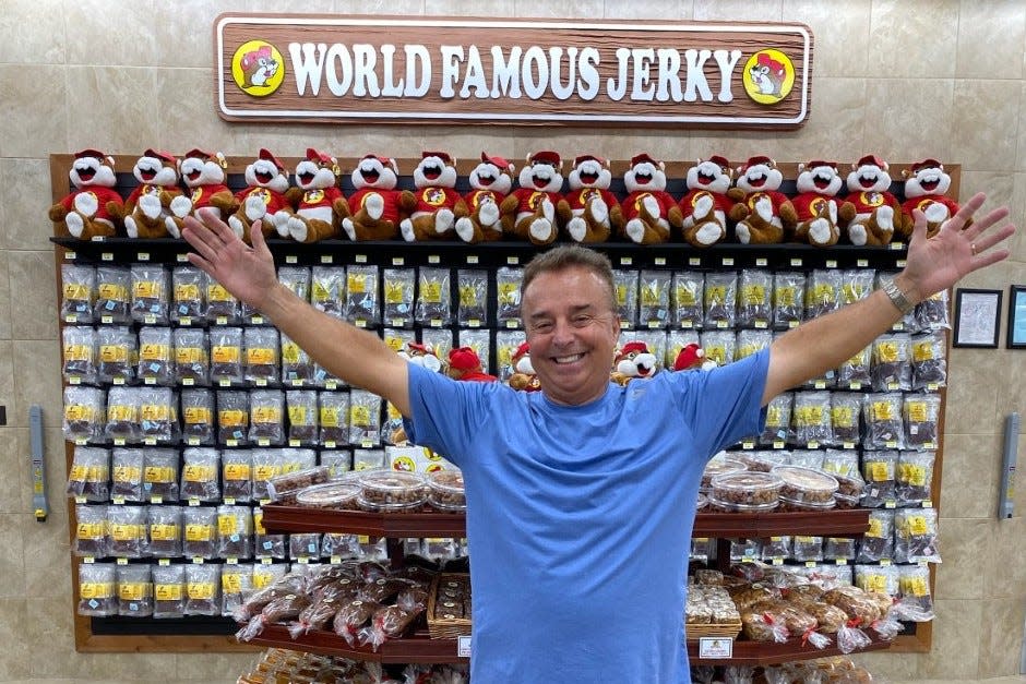 Mike McLean, a resident of Latitude Margaritaville in Daytona Beach, stands in front of the wall of jerky at the Buc-ee's gas station/travel convenience center in Gulf Shoires, Alabama in November 2019.