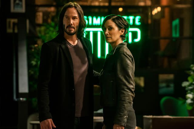 MURRAY CLOSE/WARNER BROS Keanu Reeves and Carrie Anne Moss in 'The Matrix Resurrections'