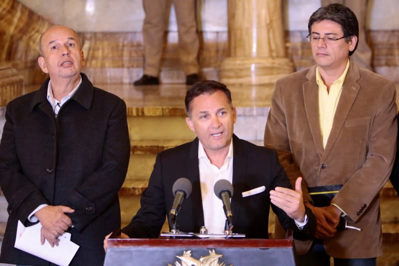 Bolivia's Minister of Defense Luis Fernando Lopez speaks during a news conference accompanied by Minister of Government Arturo Murillo and Minister of Presidency Jerjes Justiniano at the presidential palace in La Paz