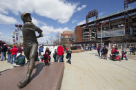 FILE - In this Thursday, April 5, 2018 file photo, a statue of Philadelphia Phillies' Mike Schmidt looks on as fans mingle outside of Citizens Bank Park prior to a baseball game against the Miami Marlins in Philadelphia. (AP Photo/Chris Szagola, File)