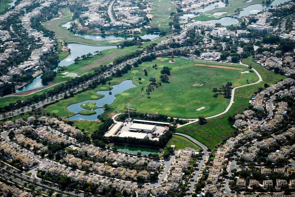 This picture taken on July 8, 2020 shows an aerial view of a Golf course in the Emirates Hills area of the Gulf emirate of Dubai, during a government-organised helicopter tour. - Dubai reopened its doors to international visitors on July 7 in the hope of reviving its tourism industry after a nearly four-month closure.