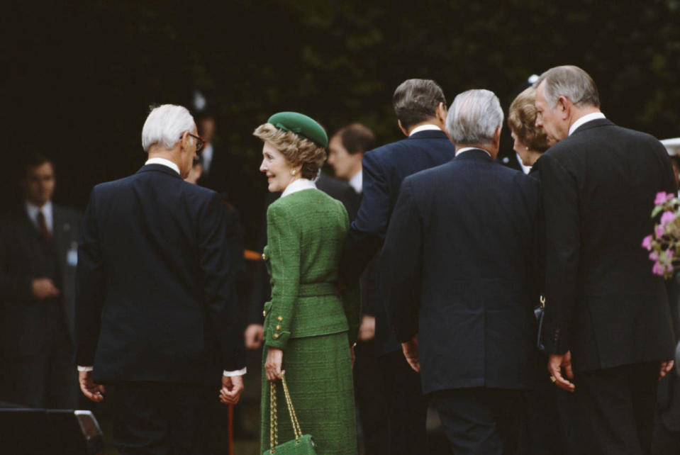 Nancy Regan in a green ensemble In London