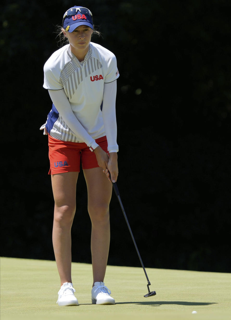 Nelly Korda, of the United States, studies her putt on 18th hole during the first round of the women's golf event at the 2020 Summer Olympics, Wednesday, Aug. 4, 2021, at the Kasumigaseki Country Club in Kawagoe, Japan. (AP Photo/Andy Wong)