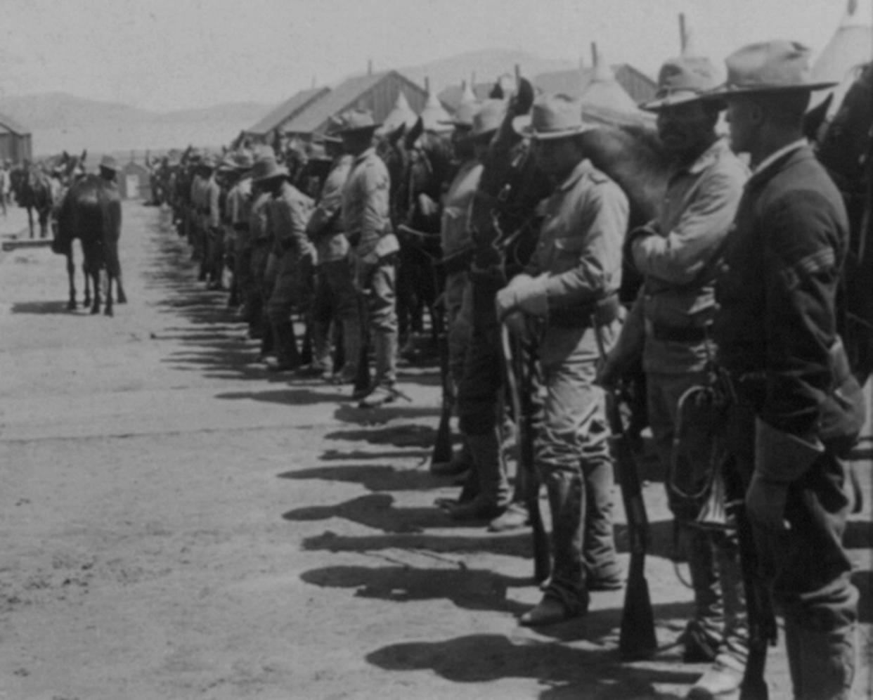 The 9th Cavalry, commanded by Charles Young, is seen at the Presidio around 1900.