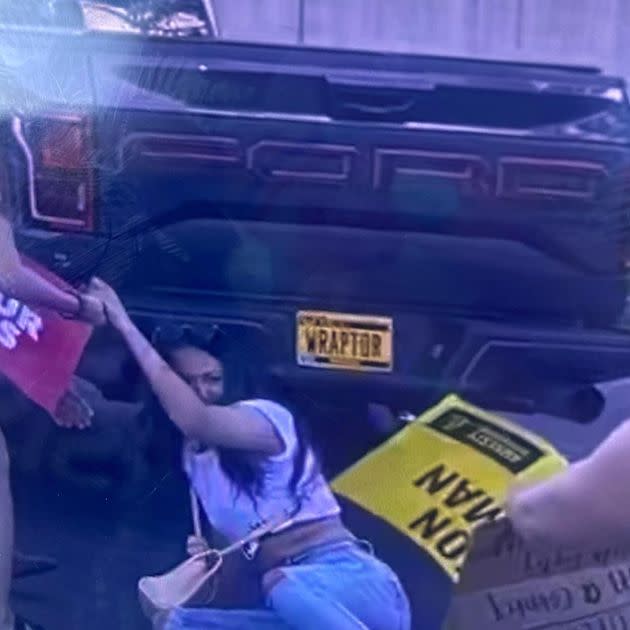 Protesters in Cedar Rapids, Iowa, fall as a driver careens into them during a demonstration against the overturning of Roe v. Wade. (Photo: Lyz Lenz)