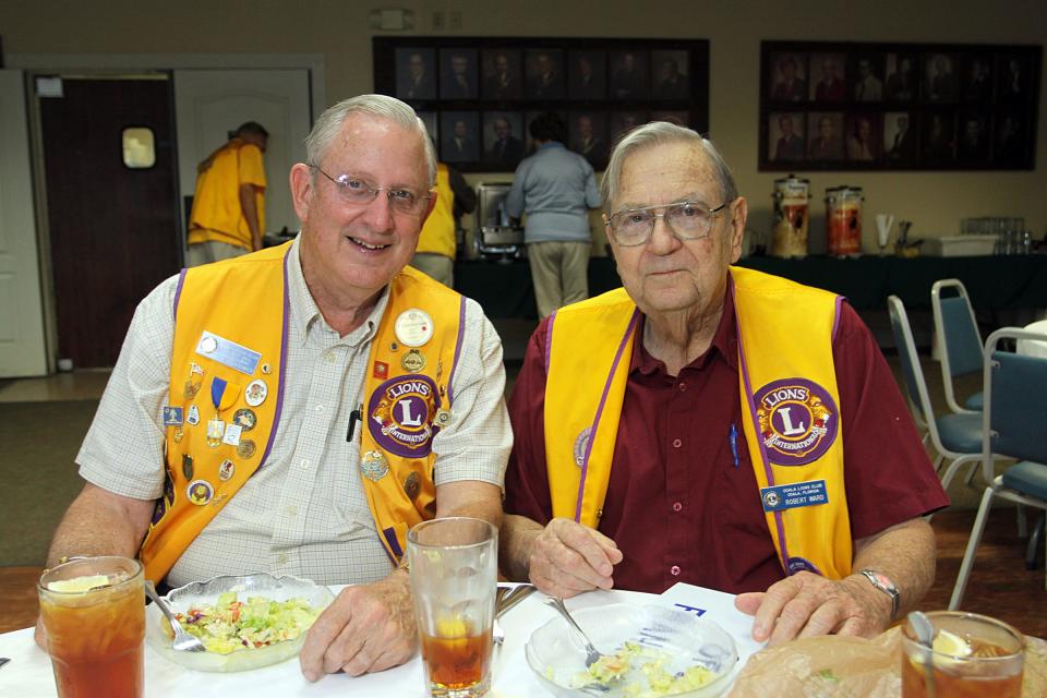 This 2010 file photo shows Bob Ward, right, seated next to Bob Hightower at an Ocala Lions Club luncheon meeting.