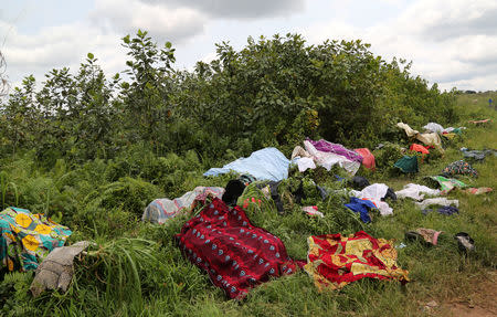 Laundry belonging to Congolese migrants expelled from Angola who crossed the border is aired to dry near Kamako, Kasai province near the border with Angola, in the Democratic Republic of the Congo, October 13, 2018. REUTERS/Giulia Paravicini