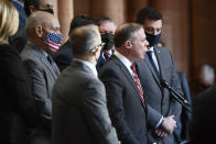 Assemblyman Minority Leader William A. Barclay, R- Fulton, second from right, stands with Assembly Republicans calling for the impeachment of New York Gov. Andrew Cuomo during a news conference at the state Capitol, Monday, March 8, 2021, in Albany, N.Y. (AP Photo/Hans Pennink)