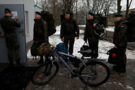 Damian Krasnodebski, 27, an architect, and other recruits check in at a barrack on their first day of 16-day basic training for Poland's Territorial Defence Forces, at a military unit in Siedlce, Poland, December 1, 2017. REUTERS/Kacper Pempel/Files