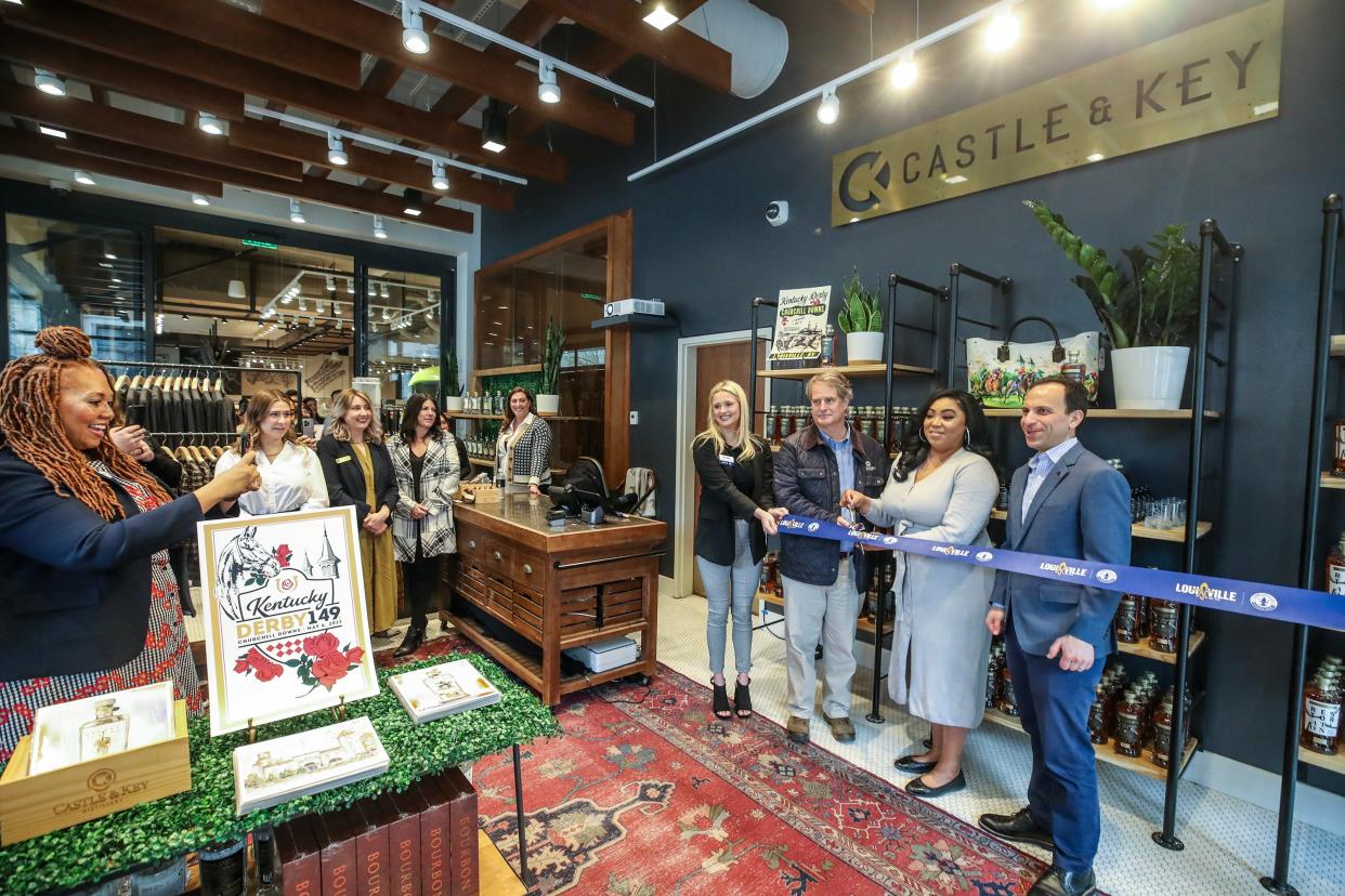 Mayor Craig Greenberg, Erica Fraley, assistant director of food and beverage for Omni, and Will Arvin, owner of Castle & Key, cut the ribbon on the new space at the Omni Hotel in downtown Louisville on Thursday, April 6, 2023