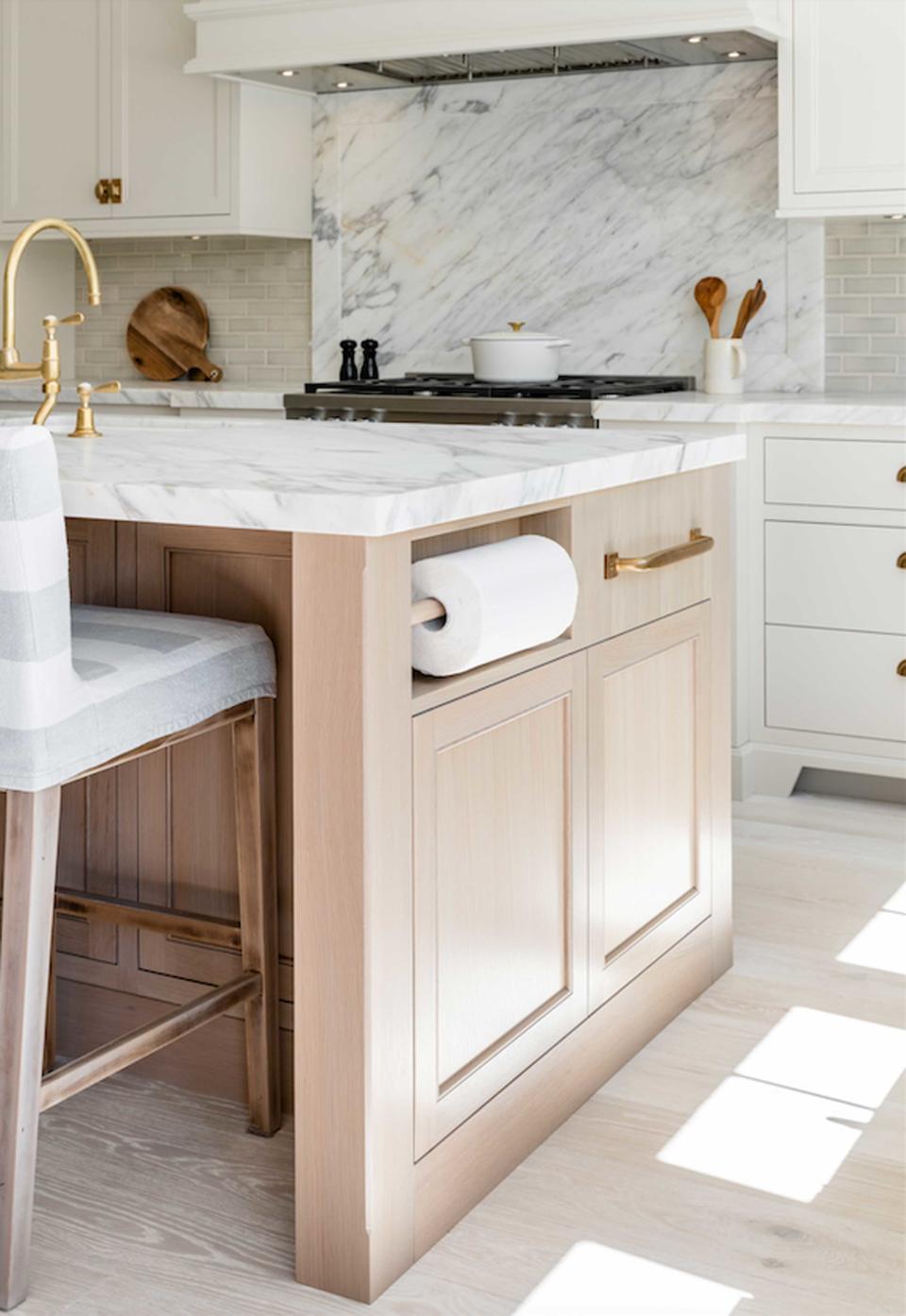 a kitchen island with a paper towel holder