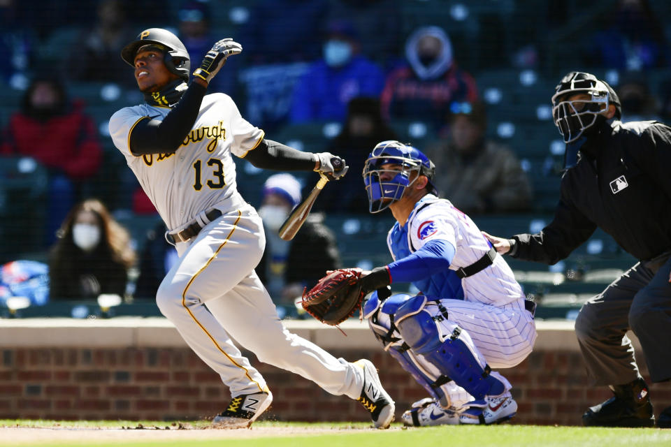 Pittsburgh Pirates' Ke'Bryan Hayes (13) watches his two-run home run during the first inning of a baseball game against the Chicago Cubs Thursday, April 1, 2021, on opening day at Wrigley Field in Chicago. (AP Photo/Paul Beaty)