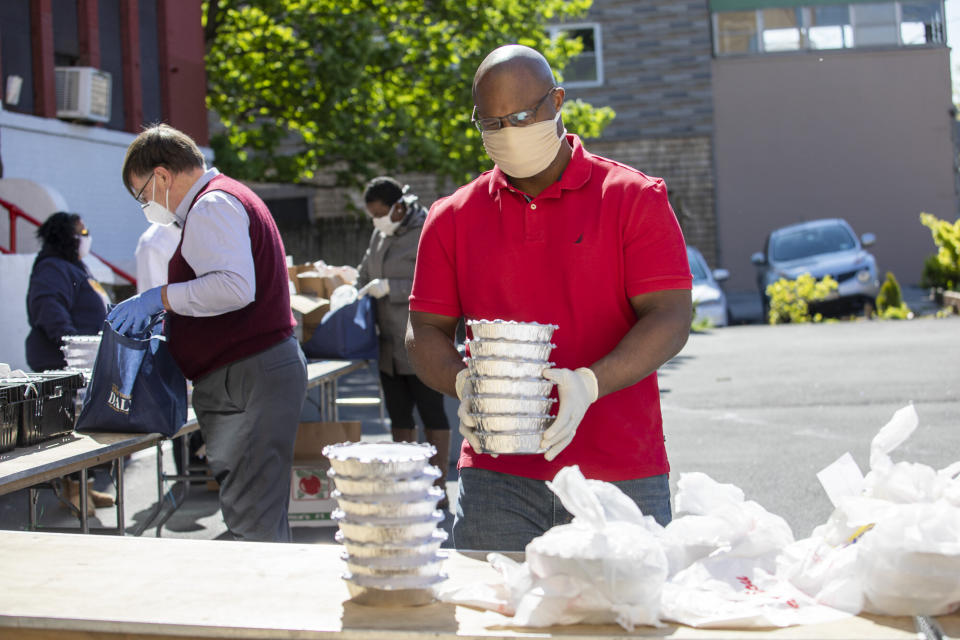 Jamaal Bowman distributes food at a food bank in Yonkers, New York. His presence in the district helped win him the backing of an influential union. (Photo: Jamaal Bowman for Congress)