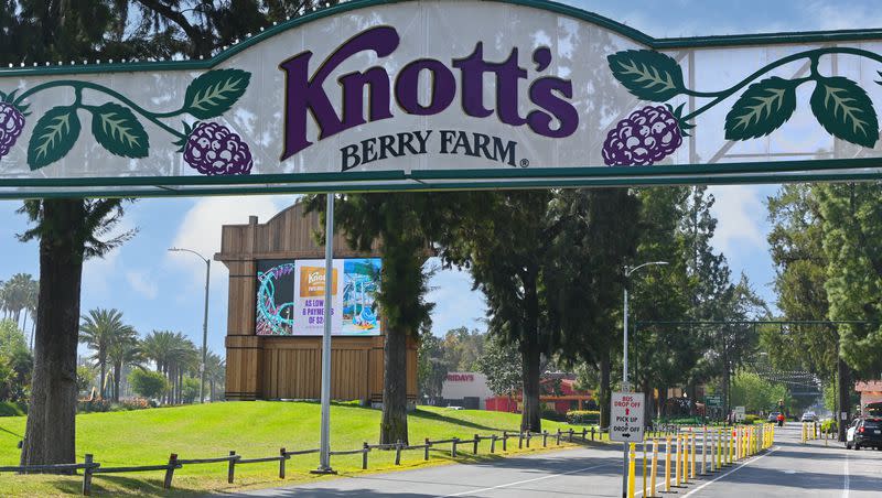 The sign over the entrance road to Knott’s Berry Farm in Buena Park, Calif., is pictured on April 7, 2023.