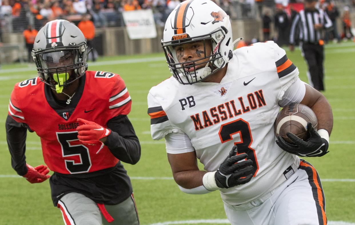 Massillon’s Dorian Pringle beats McKinley’s Jordan McElroy to the end zone for a touchdown Saturday, Oct. 21, 2023.