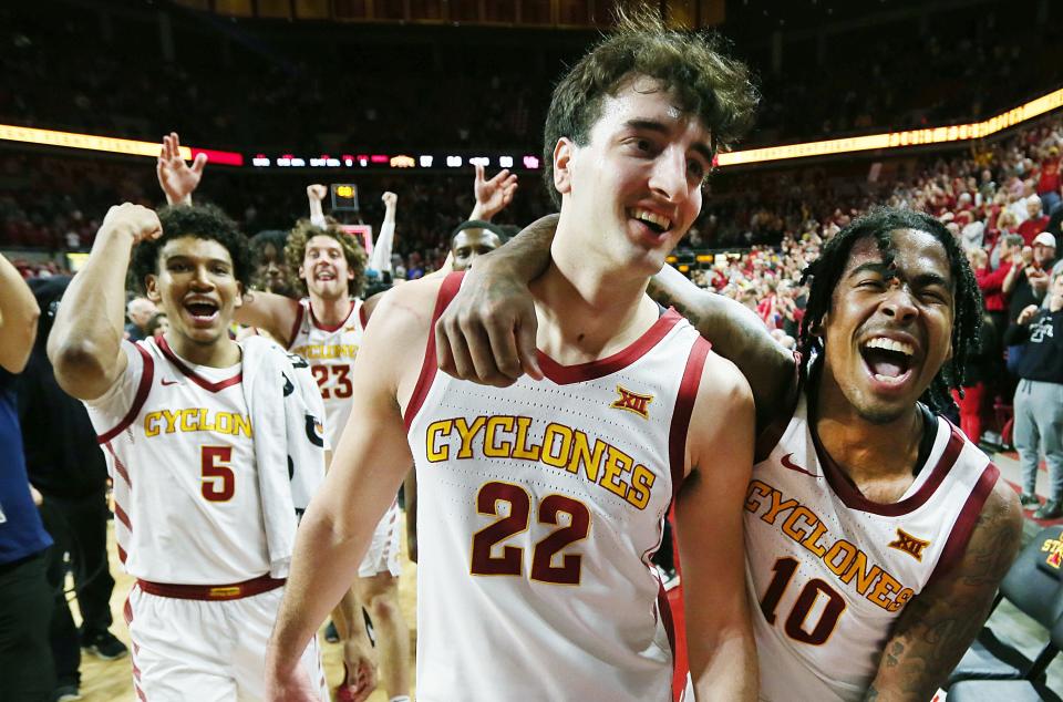 Iowa State forward Milan Momcilovic (22) and guard Keshon Gilbert (10) celebrate after the Cyclones took down the No. 2-ranked Houston Cougars, 57-53, on Tuesday night at Hilton Coliseum in Ames, Iowa. Momcilovic, a 2023 Pewaukee High School graduate, scored the game's final four points.