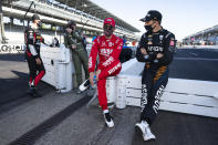 Oliver Askew, right, talks with Marcus Ericsson, of Sweden, before practice for the Indianapolis 500 auto race at Indianapolis Motor Speedway in Indianapolis, Friday, Aug. 21, 2020. The 104th running of the Indianapolis 500 auto race is scheduled to run on Sunday.(AP Photo/Michael Conroy)