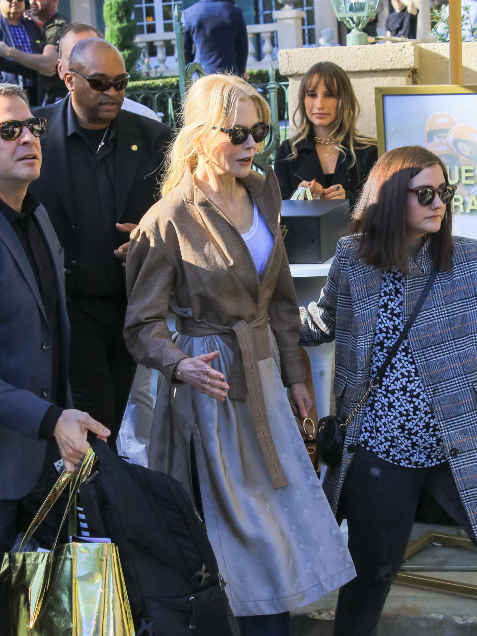 Nicole Kidman in trench coat and black sunglasses at pre Golden Globes event