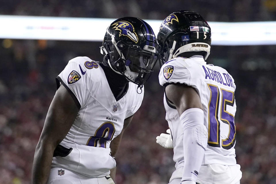 Baltimore Ravens quarterback Lamar Jackson (8) celebrates with wide receiver Nelson Agholor (15) after connecting on a touchdown pass during the second half of an NFL football game against the San Francisco 49ers in Santa Clara, Calif., Monday, Dec. 25, 2023. (AP Photo/Godofredo A. Vásquez)