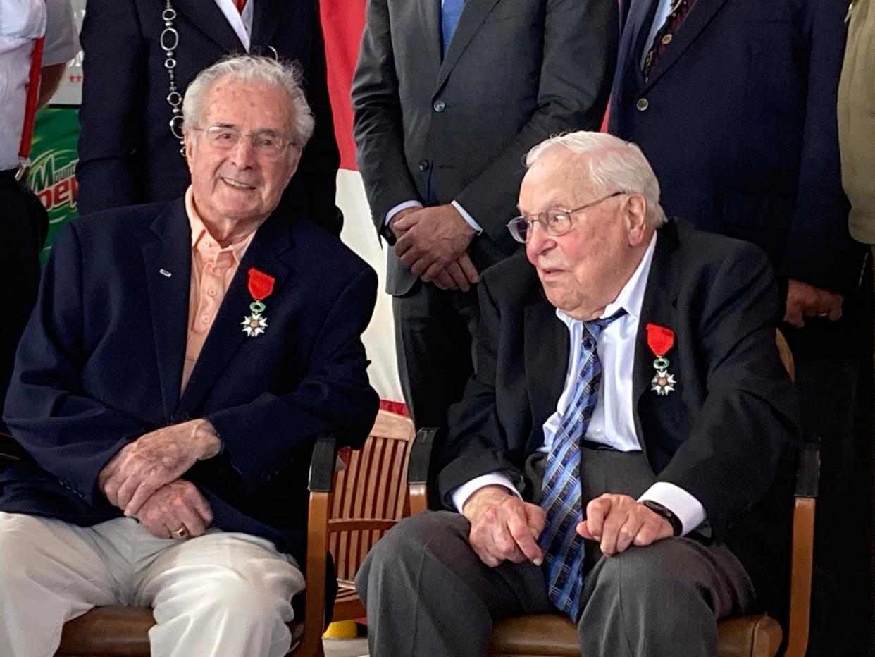 Ohio residents Walter B. Stitt, left, of Springfield, and Leonard Giorgio, of Medina County, talk Saturday morning after receiving the French Legion of Honor during a ceremony at the MAPS Air Museum in Green.