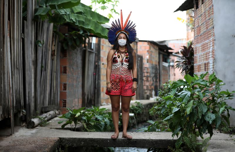 Samela Satere-Mawe, a 24-year-old biology student and Indigenous activist poses for pictures in Manaus