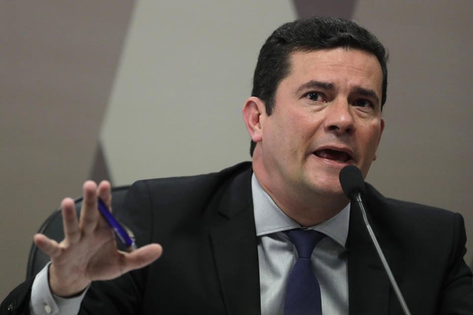 Brazil's Justice Minister Sergio Moro testifies before a senate commission, in Brasilia, Brazil, Wednesday, June 19, 2019. Press reports have accused him of allegedly coordinating with prosecutors, improperly advising them in a case against former President Luiz Inácio Lula da Silva. Moro and prosecutors deny any wrongdoing, but the Brazilian Bar Association has called for the suspension of the minister and others pending an inquiry. (AP Photo/Eraldo Peres)
