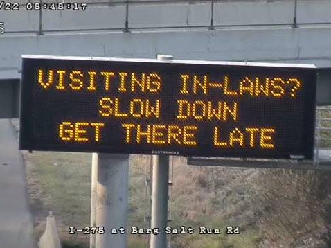 An Ohio Department of Transportation roadside safety sign that says: "Visiting the in-laws? Slow down. Get there late."