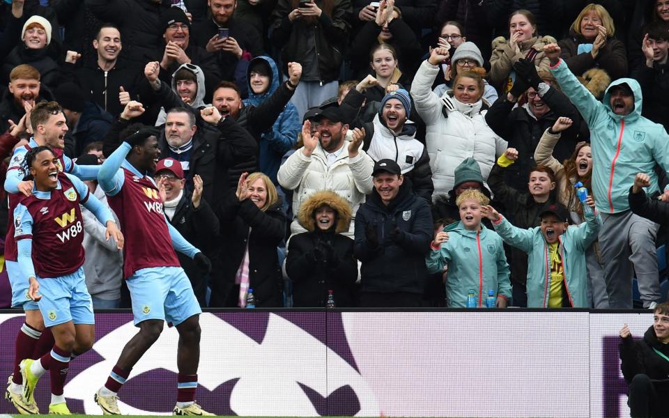 Burnley fans and players celebrate