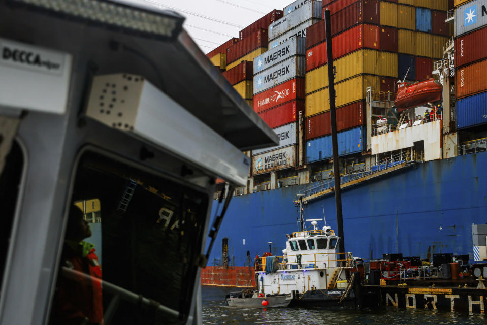 A USACE Catlett crew member looks at the collapsed Francis Scott Key Bridge, Wednesday, April 3, 2024, in Baltimore. (AP Photo/Julia Nikhinson)