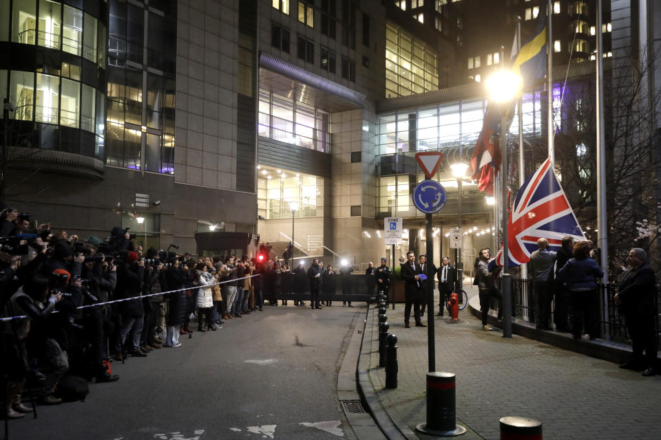 FILE - In this Jan. 31, 2020 file photo, Britain's Union flag is removed from outside of the European Parliament in Brussels. The bloc has been preoccupied for almost four years with Brexit, but now that Britain has left the bloc, the EU hopes to find more time to fix its own problems. (AP Photo/Olivier Matthys, File)