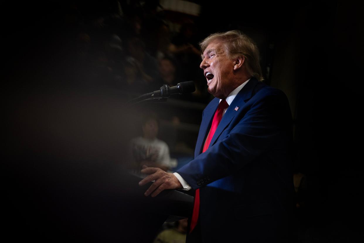 Donald Trump addresses supporters in Iowa on Dec. 2. A federal judge has rejected the former president's claims that he enjoyed absolute immunity from criminal charges accusing him of seeking to reverse the 2020 election.
