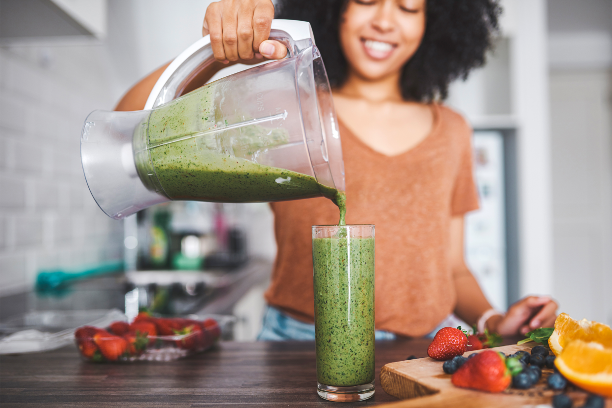 woman making smoothie