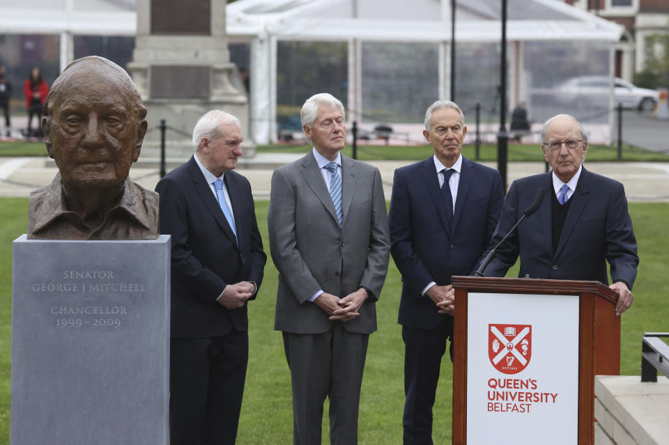 From left, Former Taoiseach Bertie Ahern, former US President Bill Clinton, former British Prime Minister Tony Blair and former senator George Mitchell at the unveiling of a bust of the former senator George Mitchell, a three-day international conference at Queen's University Belfast to mark the 25th anniversary of the Good Friday Agreement, in Belfast, Northern Ireland, Monday, April 17, 2023. Former U.S. President Bill Clinton and past leaders of the U.K. and Ireland are gathering in Belfast on Monday, 25 years after their charm, clout and determination helped Northern Ireland strike a historic peace accord. (Liam Mc Burney/PA via AP)