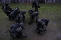 Recruits collect cartridges during their 16-day basic training for Poland's Territorial Defence Forces, at a shooting range near Siedlce, Poland, December 7, 2017. REUTERS/Kacper Pempel/Files