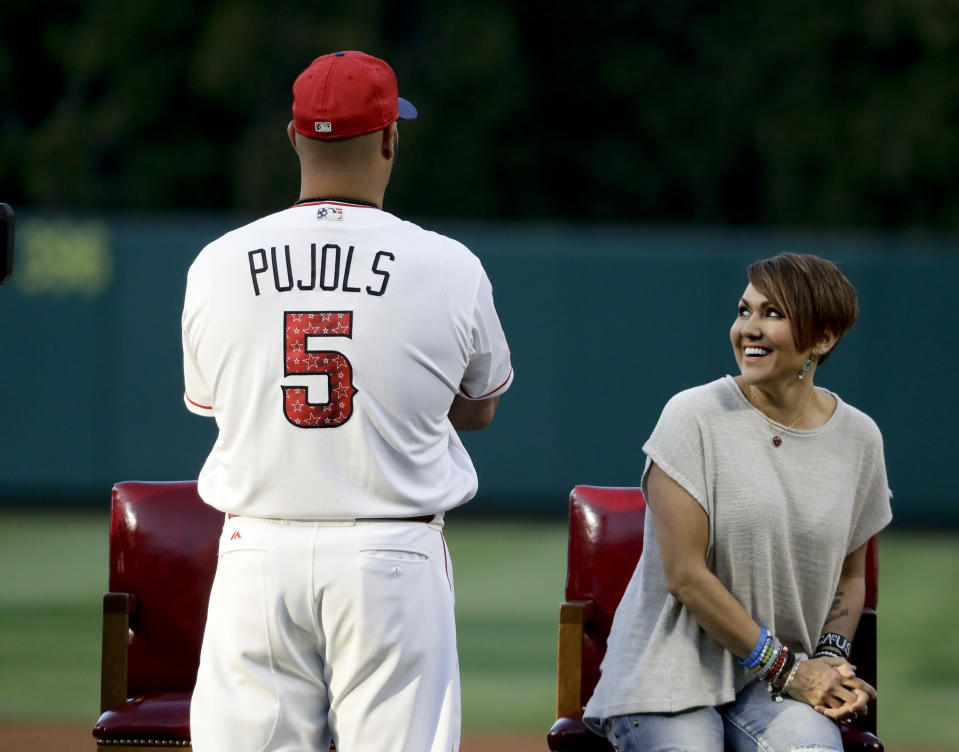 Albert Pujols watches during a ceremony honoring his 600th career home run as his wife Deidre looks on in Anaheim, Calif., Saturday, July 1, 2017. (AP)