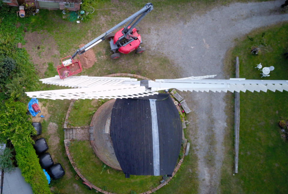 A homeowner has completed the ultimate lockdown DIY project at one of Britain's last fully-working windmills - after using a cherry picker to paint the sails by hand. Jeanette McGarry, 58, painstakingly spent three weeks touching up the paintwork on the gigantic five tonne sails as part of a refurbishment of historic Berkswell Windmill. The 70ft tall Grade II-listed building has been standing for nearly 200 years in the village of Balsall Common, West Mids., and was bought by Jeannette in 2005. She then spent £200,000 restoring the 19th century four-bladed tower mill to its former glory with the help of English Heritage after it fell into a state of disrepair.