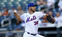 New York Mets starting pitcher Tylor Megill pitches against the Atlanta Braves during the first inning of a baseball game Wednesday, June 23, 2021, in New York. (AP Photo/Noah K. Murray)