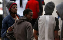 Migrants talk after they disembarked from an Armed Forces of Malta patrol boat at its base in Marsamxett Harbour, Valletta, Malta May 25, 2019. REUTERS/Darrin Zammit Lupi