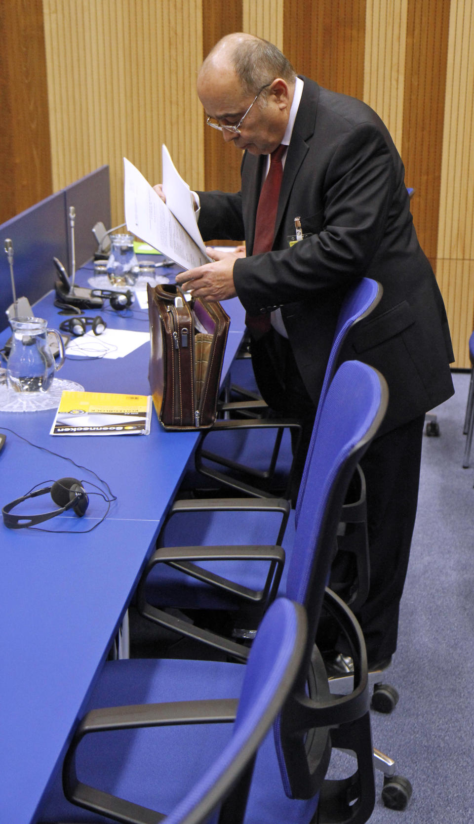 Israel's Ambassador to the International Atomic Energy Agency, IAEA, Ehud Azoulay prepares documentation for the IAEA board of governors meeting at the International Center, in Vienna, Austria, on Thursday, March 8, 2012. (AP Photo/Ronald Zak)