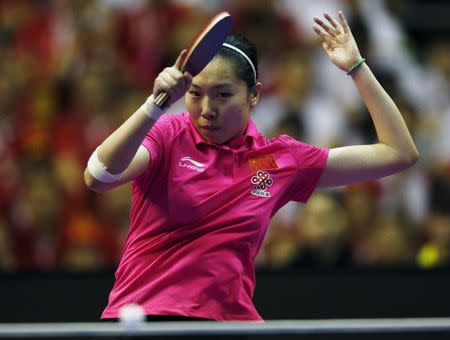 Li Xiaoxia of China competes. REUTERS/Olivia Harris